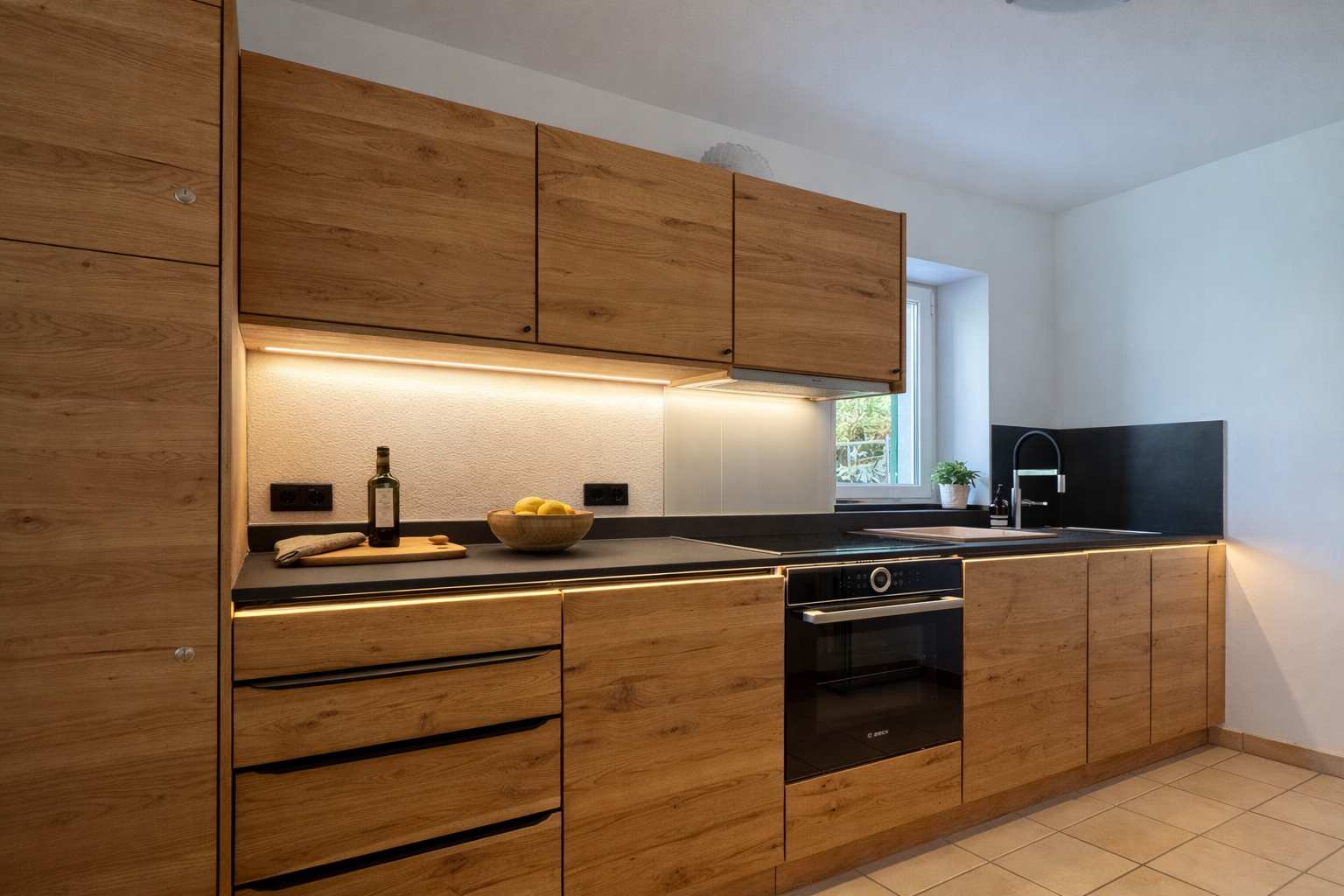 Modern kitchen with wooden cabinets, countertop and built-in appliances